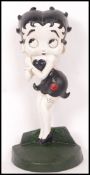 A vintage style 20th century cast iron Betty Boo doorstop. Measure approx 35cms tall.