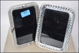 A near matching pair of stamped 925 easel back gla