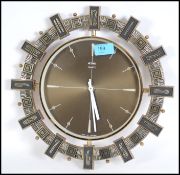 An original 1970's vintage Metamec wall clock with bronzed face and white hands.  It is styled