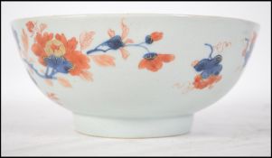A Chinese 19th century Imari pattern bowl with foliate decoration spray to the inside centre, the