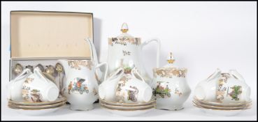 A 20th century tea service by Limoges consisting of teapot, trios, lidded sugar bowl and creamer.