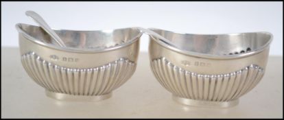 A pair of Edwardian silver hallmarked table salts