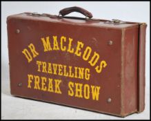 A Vintage leather upcycled leather suitcase. The c