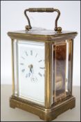 A Matthew Norman 1750 brass carriage clock having handle atop over open window escapement. Twin