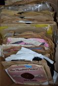 A large quantity of 78rpm records featuring several artists, genres and labels.