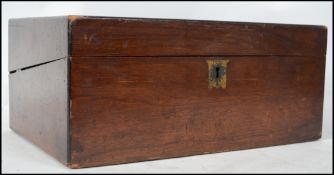 A Victorian mahogany writing slope having hinged t