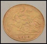An Edwardian half sovereign dating to XXXX retaining the original leather purse it was purchased