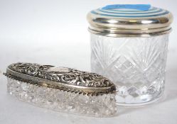 Two silver hallmarked lidded cut glass dressing table pots