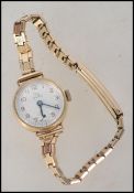 A 9ct gold ladies dress / cocktail watch by Record
