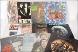 A collection of vinyl long play LP records to include The Rolling Stones x 2, Wings, Crosby Stills