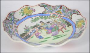 A Chinese porcelain famille rose plate, with scall