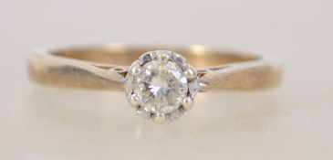 A ladies 9ct gold and diamond ring having a central claw mounted diamond approx 25pnts. Total weight