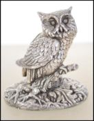A silver hallmarked cast novelty collectable owl with the makers mark C.S. along with the date