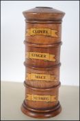A turned fruitwood four section spice tower with l