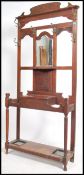A late Victorian Art Nouveau oak hall stand with h