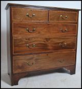 An Edwardian mahogany inlaid chest of drawers. Rai