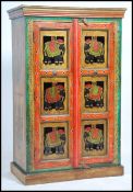 An unusual 20th century Indian handpainted cabinet with cast metal embellished doors in the shape of