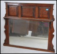 An early 20th century Edwardian oak overmantel mir