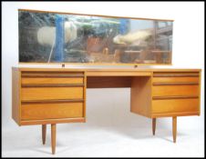 A 1970's retro teak wood Danish inspired dressing