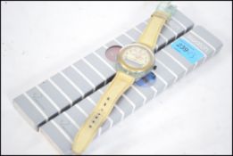 A group of three collectable Swatch watches to include to cased unused examples along with an