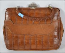 A vintage early to mid 20th century Crocodile leather ladies clutch / handbag. Having a top clasp