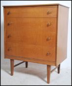 A 1970's teak wood Danish influence chest of drawe