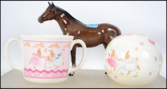 A Royal Doulton figurine of a horse being stamped