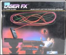 A retro 20th century 1980's boxed Laser FX system in the original box with leads and instructions.