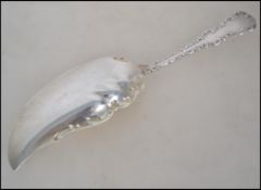 A large Sterling silver fish knife of rococo form