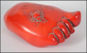 A possible 19th century large  Chinese coral carving of a foot having the big toe turned up and a