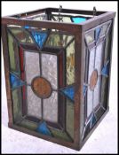 A fabulous arts & crafts stained and leaded glass lantern lamp shade - ceiling lamp having multi
