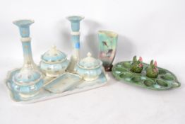 A 19th century Staffordshire dressing table set comprising candlesticks, rouge pots etc set on