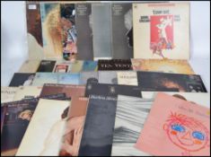 A collection of vinyl long play LP records. All re