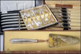 A large quantity of flatware to include bone handl