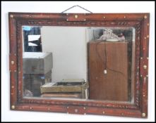 A vintage 20th century Arts and Crafts oak framed