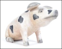 A large decorative wooden carved figure of a spott