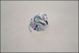 An unusual silver and marcasite gem set snake ring.  Weight 6.7g. Size expandable.