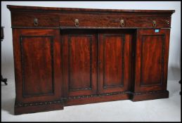 A 19th century Regency inverted breakfront sideboa