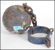 A vintage Victorian antique cast iron ball and chain leg iron having painted lettering. Weighs