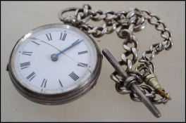 A silver London hallmarked fob watch and albert ch