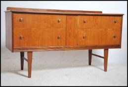 A 1970's teak wood Danish influence low sideboard