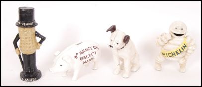 A collection of 4x vintage style 20th century small cast iron money banks to include; pig, Peanut