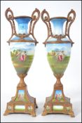 A pair of 19th century gilt metal and ceramic Sevres manner twin handled vases. Each with gilt metal