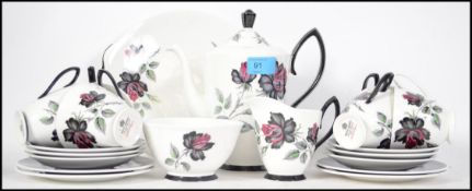 A Royal Albert ' Masquerade ' pattern ceramic part tea service comprising cups, saucers, plate etc