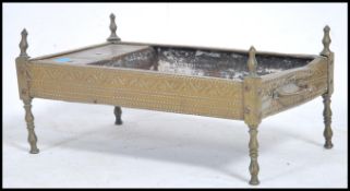 An unusual antique  anglo-colonial brass travelling firepit raised on turned legs with rectangular