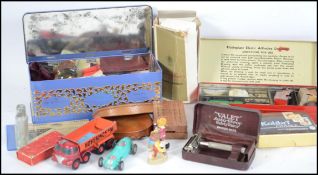 A tin full of mixed collectables to include: Ronson lighter; Mosda stream line lighter; skeleton