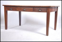 A 1930's Air Ministry solid oak desk having square