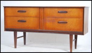 A 1970's retro Danish influence teak wood sideboar