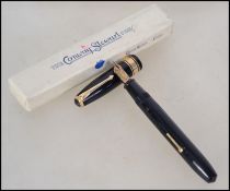 A vintage early  20th century Conway Stewart lever fill fountain / ink pen. Having a 9ct gold nib.
