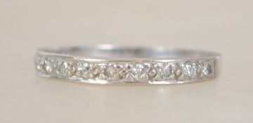 An 18ct white gold and diamond ladies half eternit